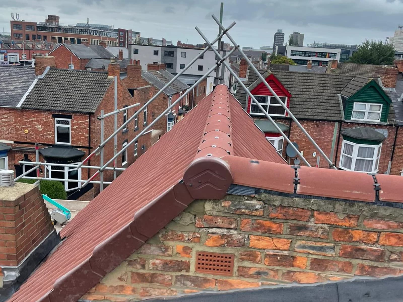 A completed tiled hip-and-ridge roof on a terrace in County Durham